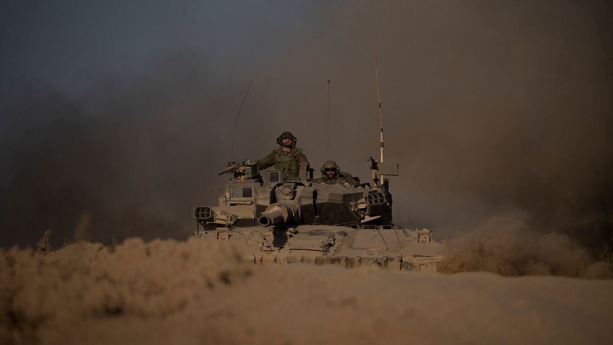 Israeli soldiers in a tank near the Israeli-Gaza border.