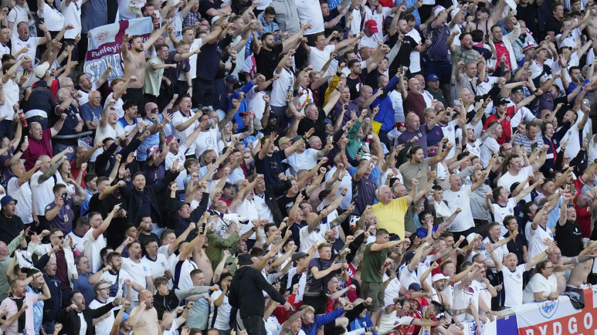 England fans celebrate after winning a quarterfinal match between England and Switzerland at the Euro 2024 soccer tournament in Duesseldorf, Germany, Saturday, July 6, 2024.