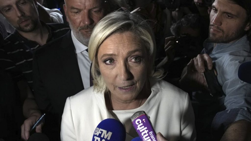 Far-right National Rally party leader Marine Le Pen answers reporters after the second round of the legislative election at the party election night HQ in Paris, 7 July 2024