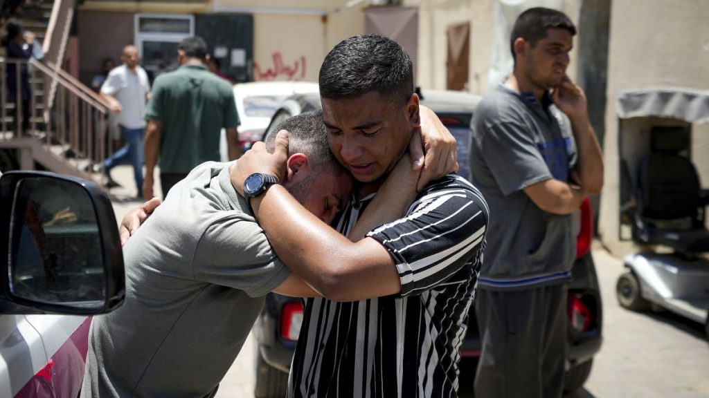 Palestinians mourn relatives killed in the Israeli bombardment of the Gaza Strip, at a hospital morgue in Deir al-Balah.