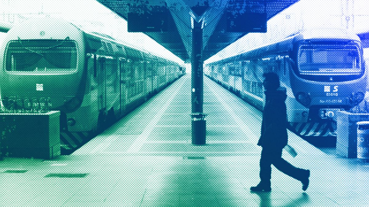 A man walks past trains in Milan, January 2012