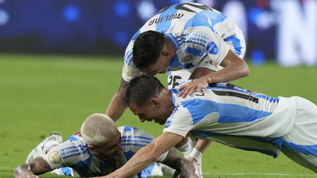 Argentina players celebrate after defeating Colombia in the final of the Copa America football tournament in Miami Gardens, Florida, Monday, July 15, 2024.