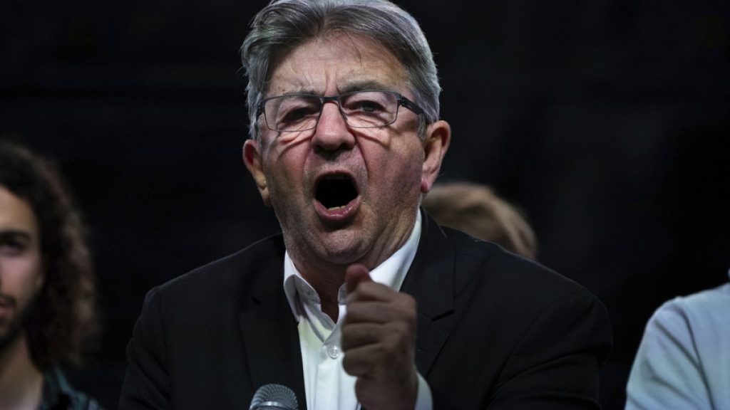 Far-left leader Jean-Luc Melenchon speaks at Republique square during a protest against the far-right National Rally