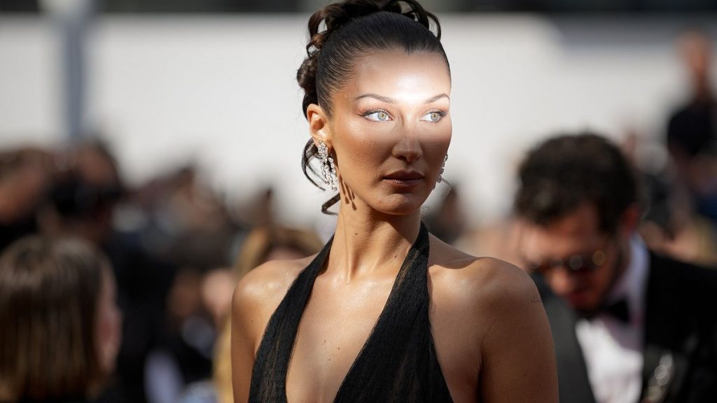 Bella Hadid poses for photographers upon arrival at the premiere of the film