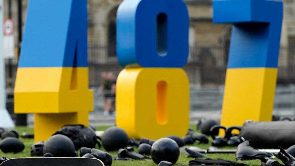 A display with sports equipment and the number 487 is arranged at Parliament Square in London, Wednesday, July 24, 2024