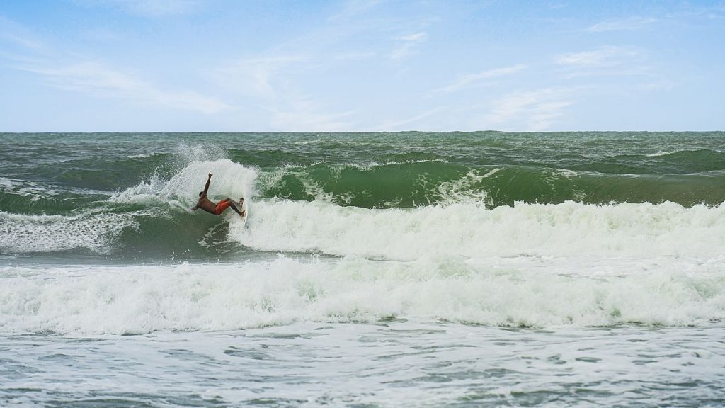 A man surfing in Brazilian waters