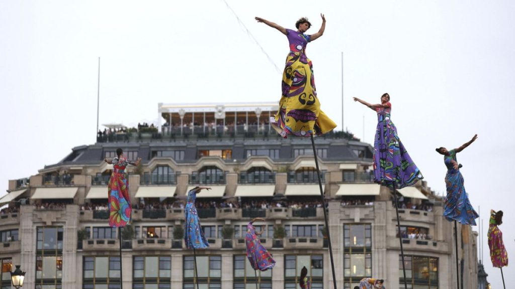 Acrobats perform during the opening ceremony for the 2024 Summer Olympics in Paris, France, Friday, July 26, 2024.