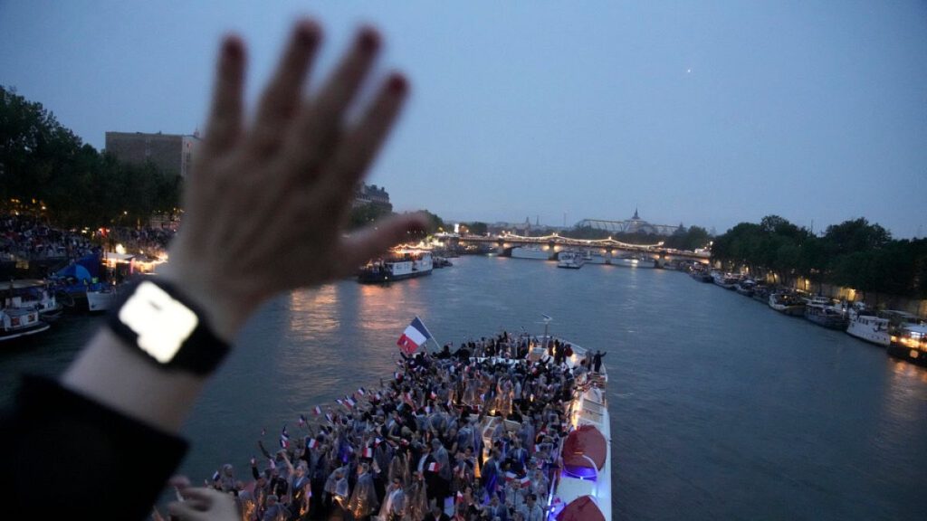 France team parades along the Seine River in Paris, France, during the opening ceremony of the 2024 Summer Olympics, Friday, July 26, 2024