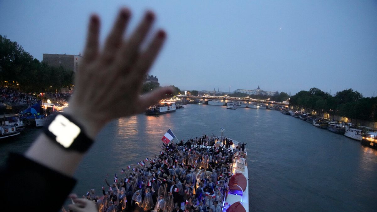 France team parades along the Seine River in Paris, France, during the opening ceremony of the 2024 Summer Olympics, Friday, July 26, 2024