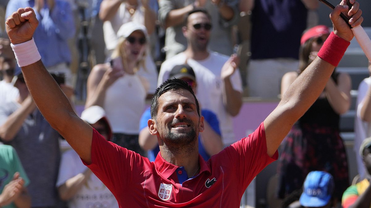 Djokovic celebrates after defeating Rafael Nadal in their men