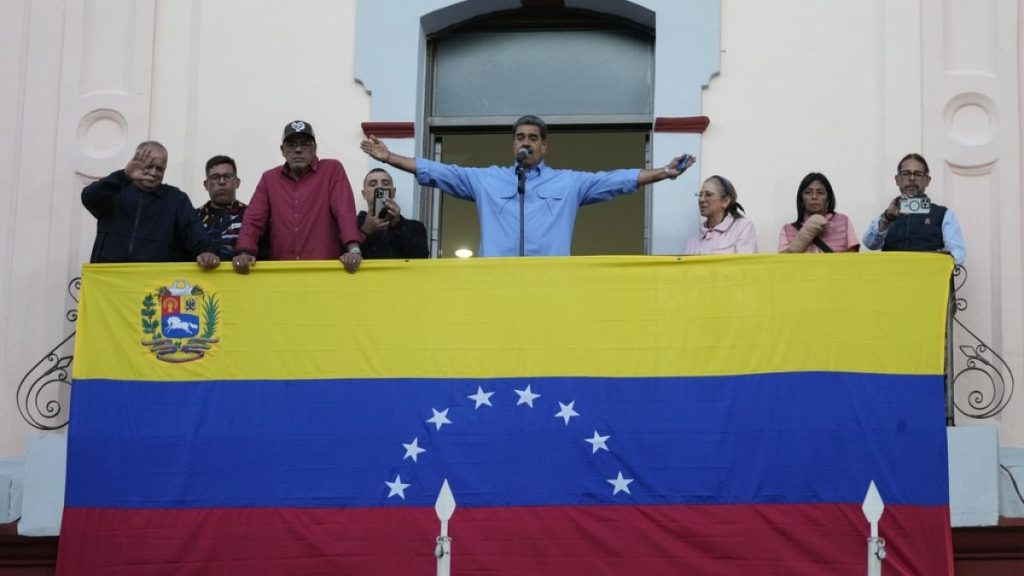 President Nicolas Maduro gestures to supporters during a speech from the presidential palace in defence of his reelection, in Caracas, Venezuela on Tuesday