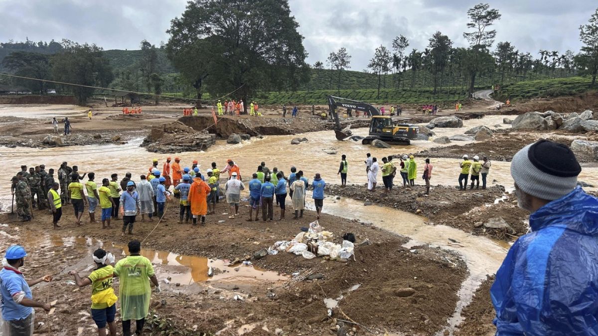 Rescuers stand near a bridge that got washed away in Tuesday’s landslides at Chooralmala, Wayanad district, Kerala state, India, Wednesday, July 31, 2024.