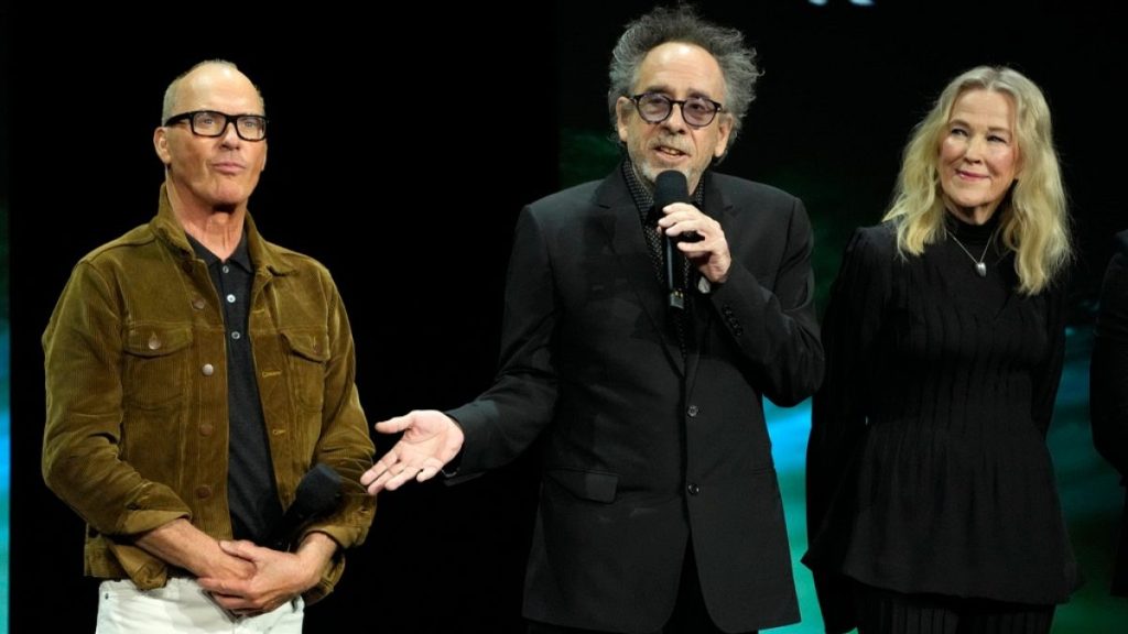Tim Burton, centre, director of "Beetlejuice Beetlejuice," discusses the film alongside actors Michael Keaton, left, and Catherine O