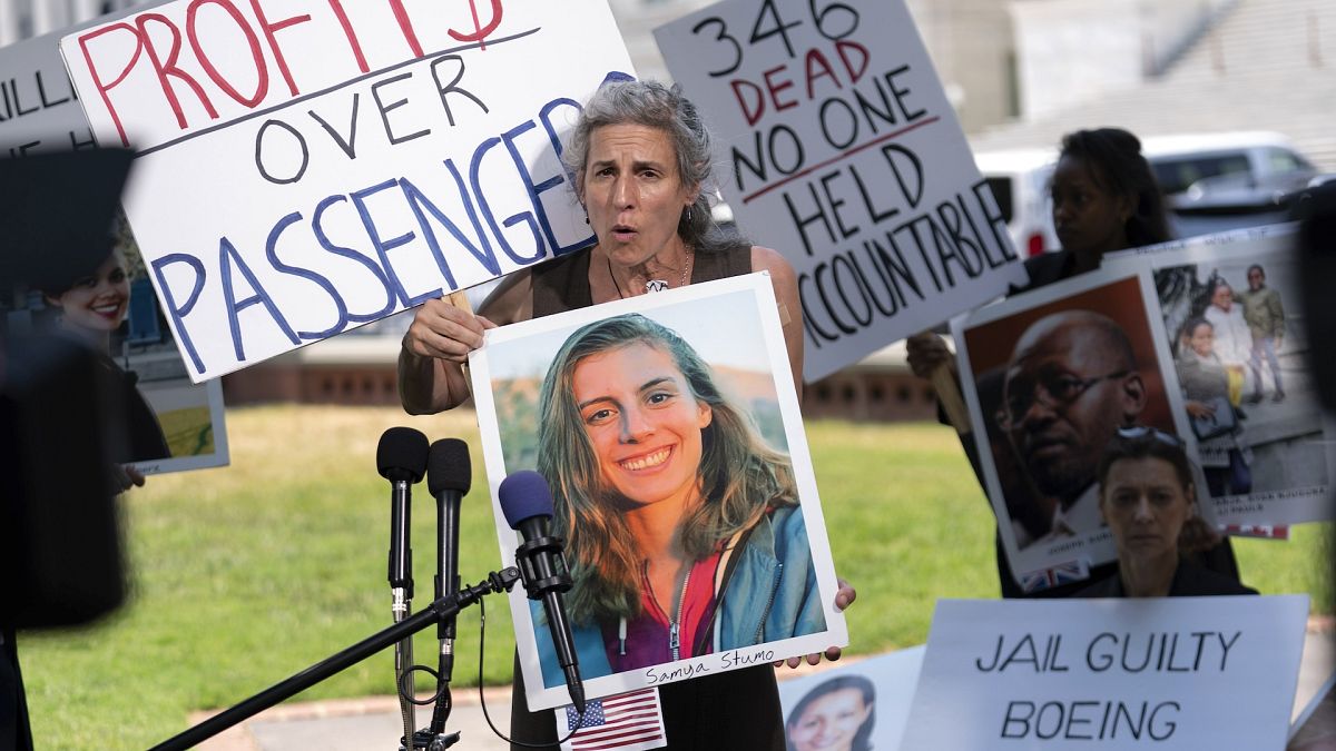 Nadia Milleron, the mother of Samya Rose Stumo, who died in the Ethiopia crash, holds a picture of her daughter at a protest in June