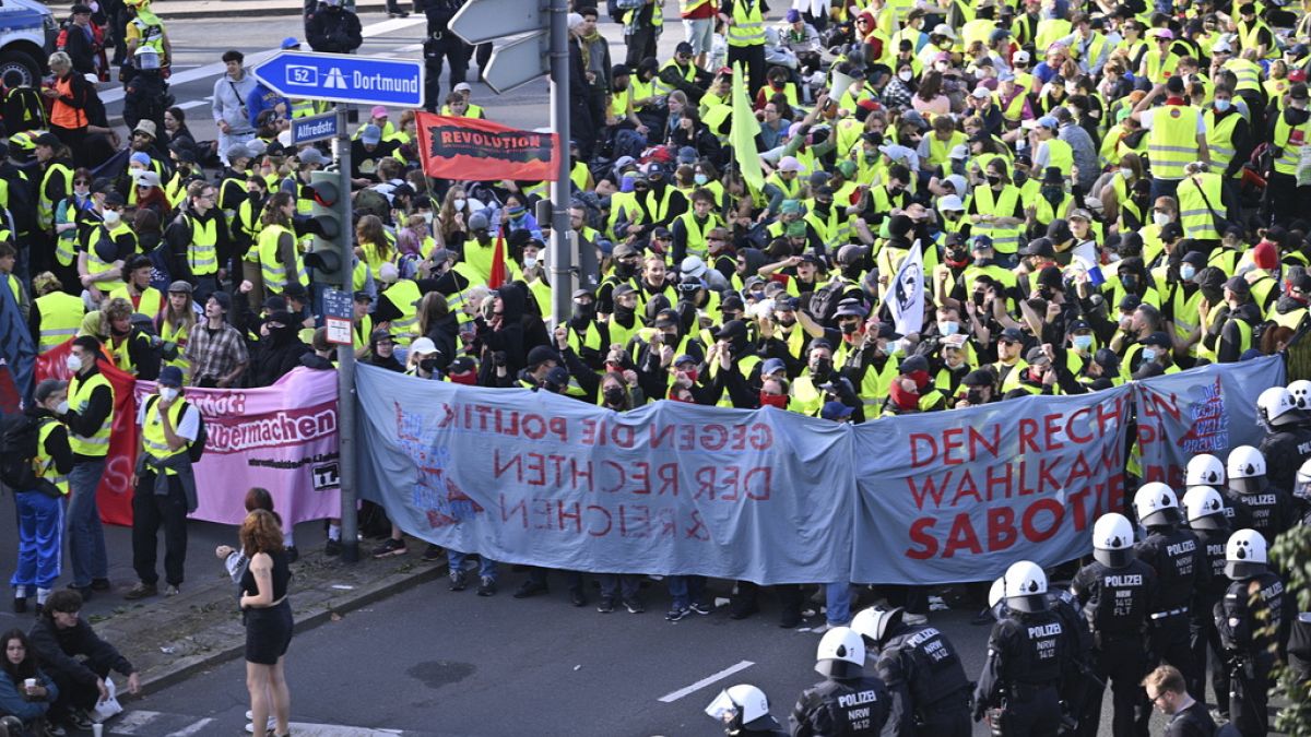 People demonstrate against the far right AfD party conference in Essen, Germany, Saturday, June 29, 2024.