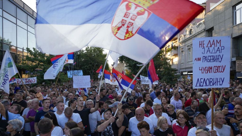 People attend a protest in Sabac, Serbia, Monday, July 29, 2024. (AP Photo/Darko Vojinovic)