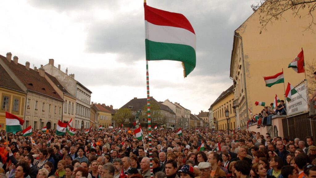 Supporters of the senior opposition party, the Fidesz - Hungarian Civic Alliance wave flags during a campaign rally in the Castle of Buda in Budapest, Monday, 10 April 2006.