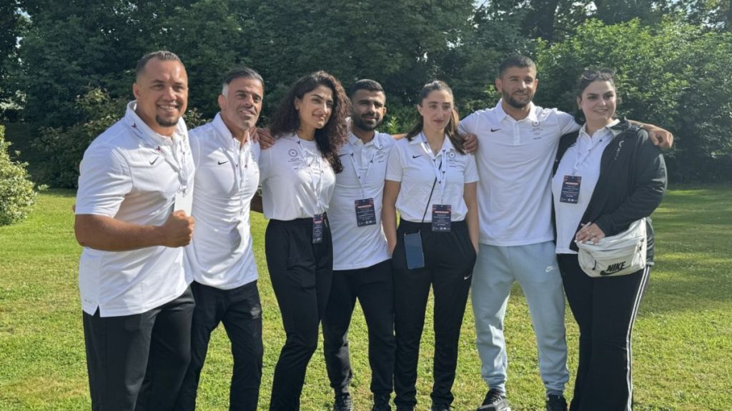 A pic from IOC Media on X shows the refugee olympic team meeting in Bayeux