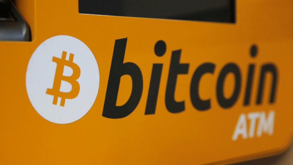 A Bitcoin logo is displayed on an ATM in Hong Kong, Thursday, Dec. 21, 2017.