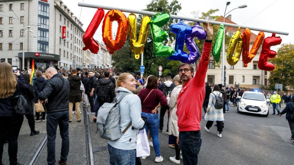 People gather to join a rally of thousands in Bratislava, Slovakia in 2022, to honour two gay men who were shot dead in the capital