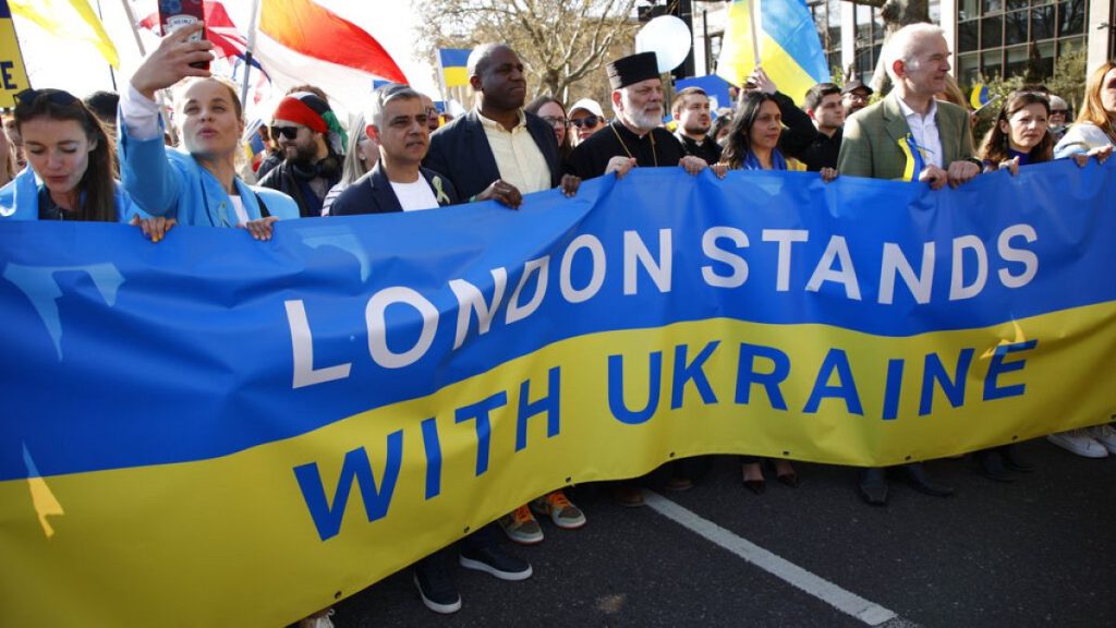 Mayor of London Sadiq Khan, third left, and Labour Party MP David Lammy, fourth left, join demonstrators taking part in the