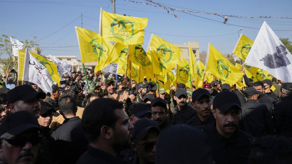 Members from the Popular Mobilization Forces attend the funeral of fighters from Kataib Hezbollah, who were killed in a US airstrike in Babil province, Iraq, July 31, 2024.