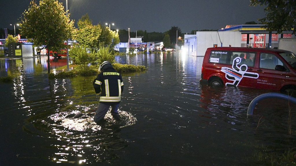 Rain flooded a service station in Aurich, Germany.