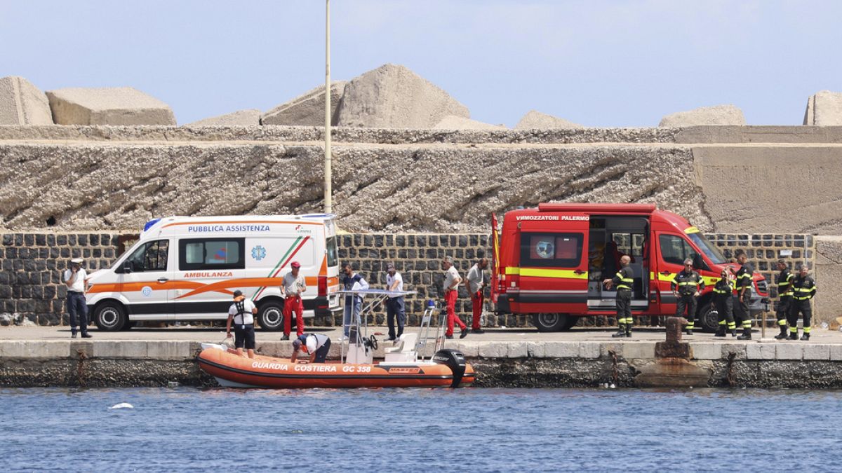 Emergency services at the scene of the search for a missing boat, in Porticello Santa Flavia, Italy, Monday, Aug. 19, 2024.