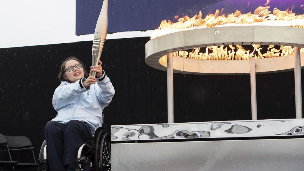 British Paralympian Helene Raynsford holds the Paralympic Torch during the flame lighting ceremony in Stoke Mandeville, August 24, 2024