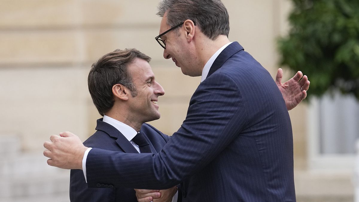 French President Emmanuel Macron, left, welcomes Serbian President Aleksandar Vucic before their talks Thursday, Nov. 10, 2022 at the Elysee Palace in Paris.