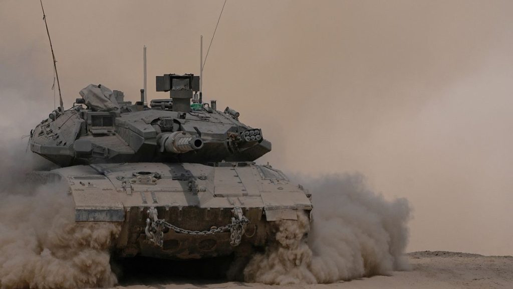 An Israeli tank manoeuvres near the Israel-Gaza border, southern Israel, 29 August 2024