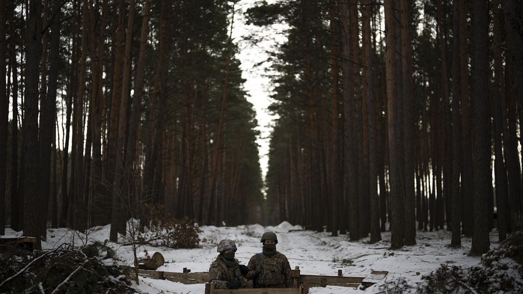 Ukrainian servicemen stand at a position close to the border with Belarus, Ukraine, Wednesday, Feb. 1, 2023.