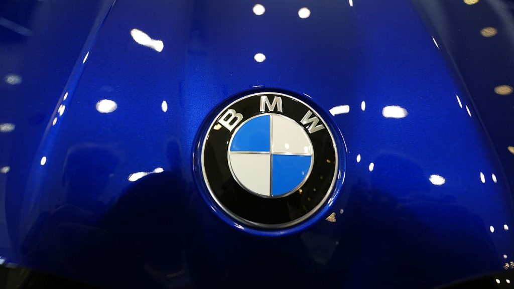 The company logo shines on the hood of an unsold vehicle at a Mini Honda BMW dealership on July 22, 2024, in Highlands Ranch.