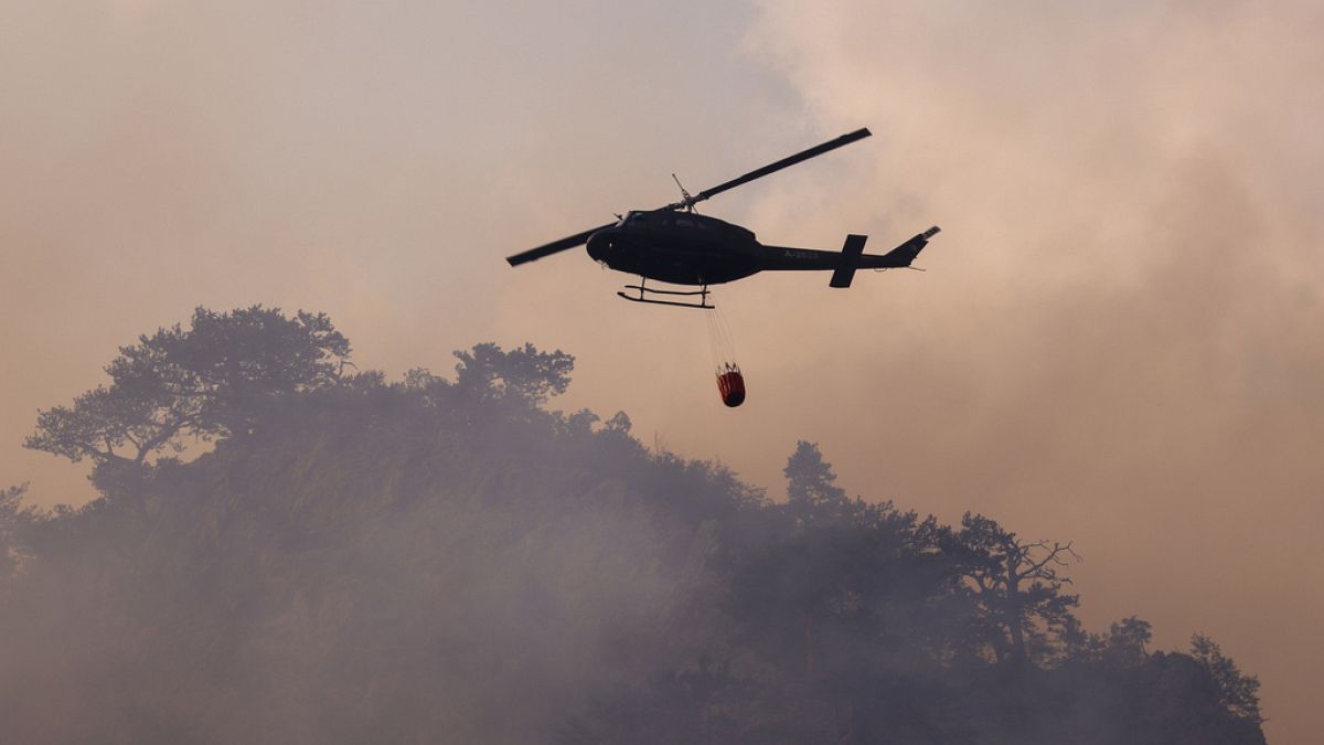 A firefighting helicopter in action at Tjentiste, Bosnia and Herzegowina, 13. August 2024.