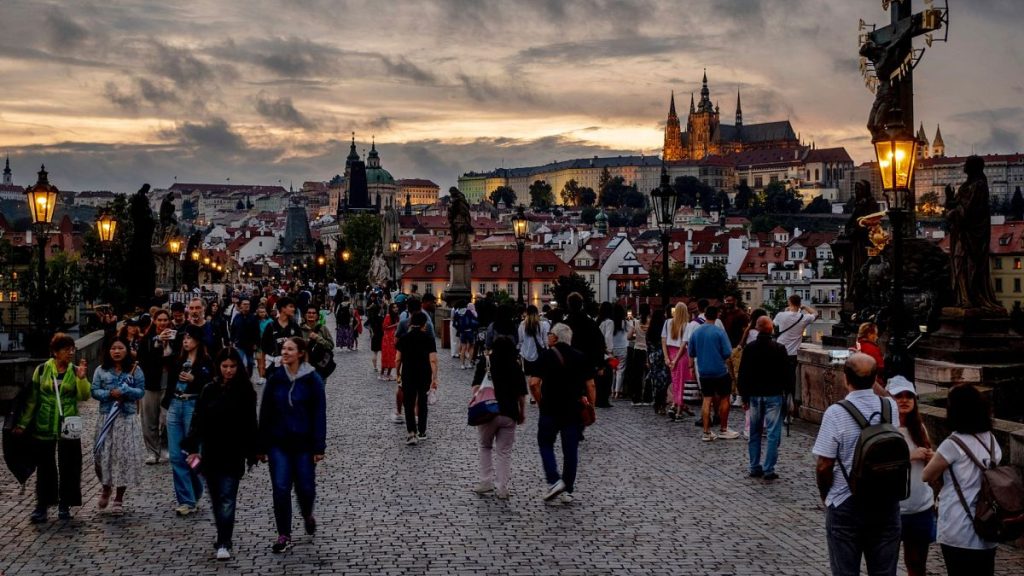 Tourists walk over the Karlsbruecke (Charles Bridge) in Prague, Czech Republic, 18 August 2024.