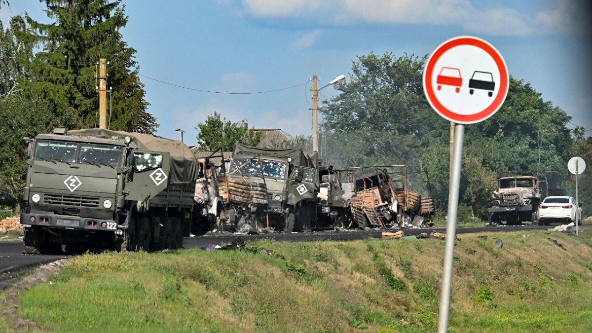 A column of Russian army trucks damaged by shelling by Ukrainian forces is seen on the highway in the Sudzhansky district in the Kursk region of Russia, on Aug. 9, 2024.