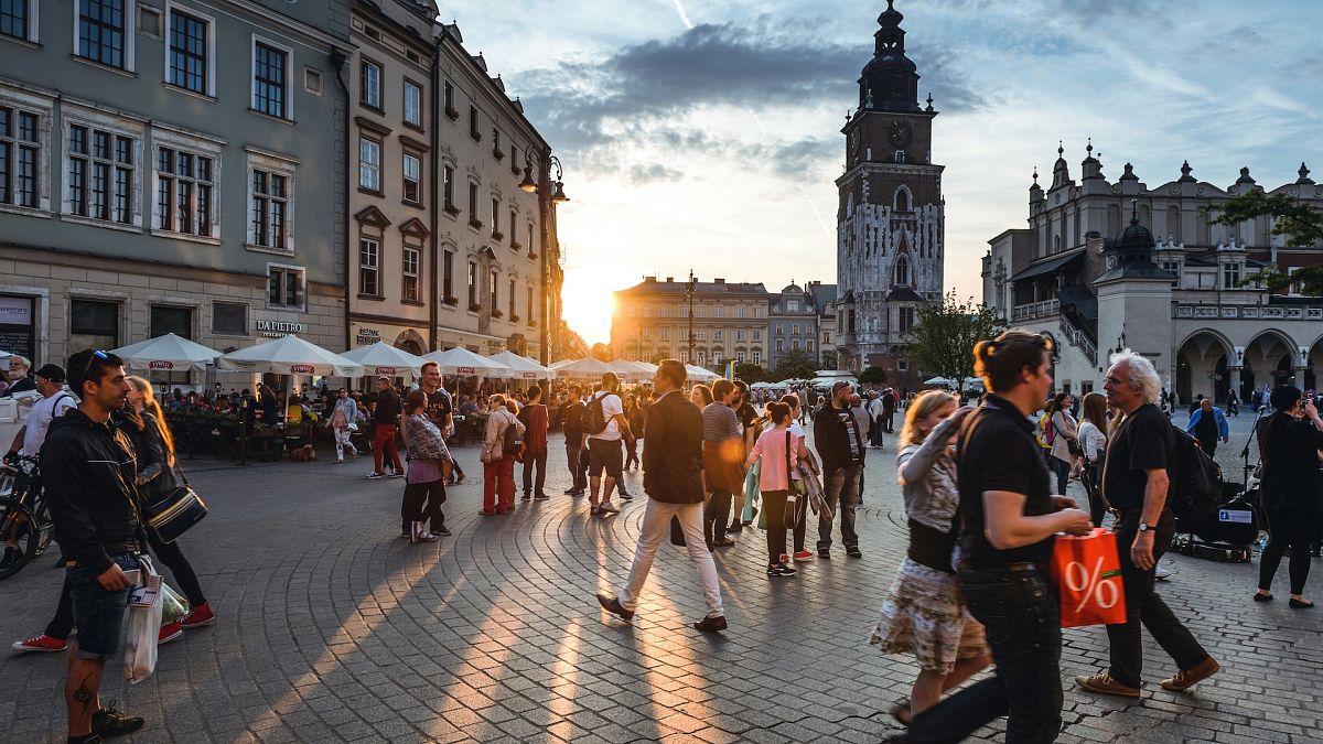 Tourists in Main Market Square Kraków, Poland