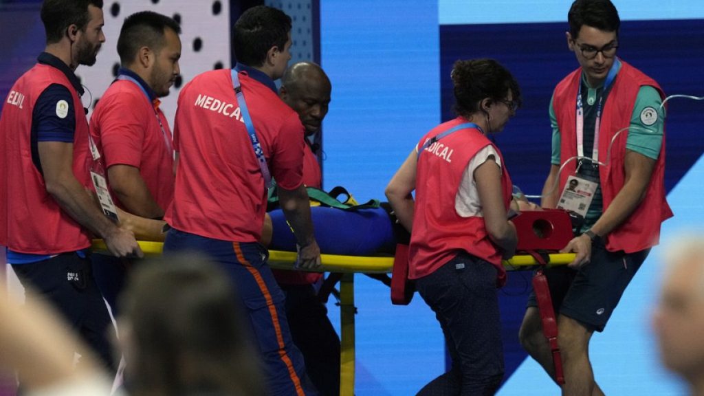 Slovakia’s Tamara Potocka is taken on stretcher from the pool deck after collapsing following a heat of the women