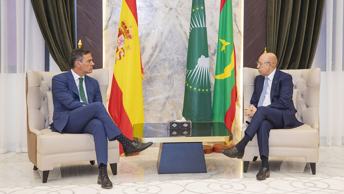 Prime Minister of Spain Pedro Sánchez, left, is welcomed by Mauritanian President Mohamed Ould Ghazouani, Tuesday, Aug. 27, 2024, in Nouakchott, Mauritania.