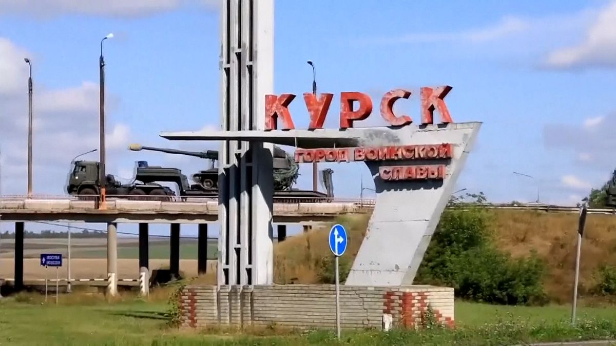 A tank on the back of a truck being transported into the Russian territory of Kursk, according to recently released Russian Defence Ministry footage from August 10, 2024.