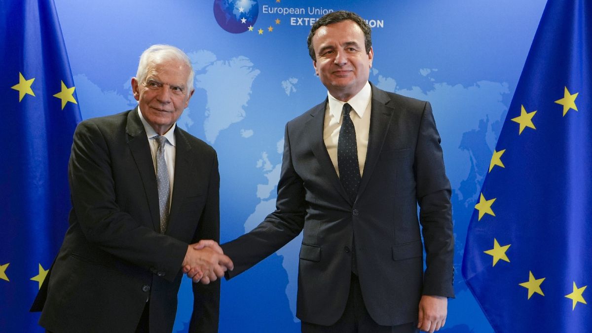 European Union foreign policy chief Josep Borrell, left, poses for the media with Kosovo