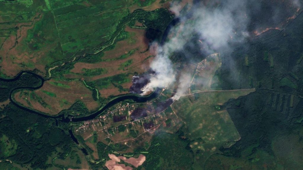 This satellite image released by Planet Labs PBC shows fires near the village of Krasnooktyabrskoe in Russia