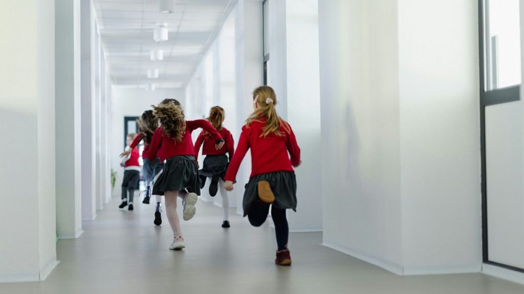 Primary school students running to class