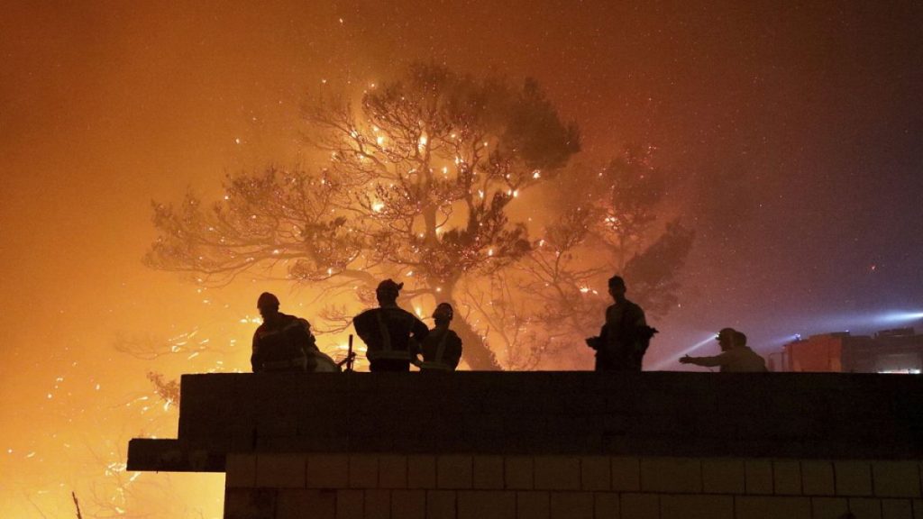 Firefighters gather near the wildfire in Tucepi, Croatia, late Tuesday, July 30, 2024.