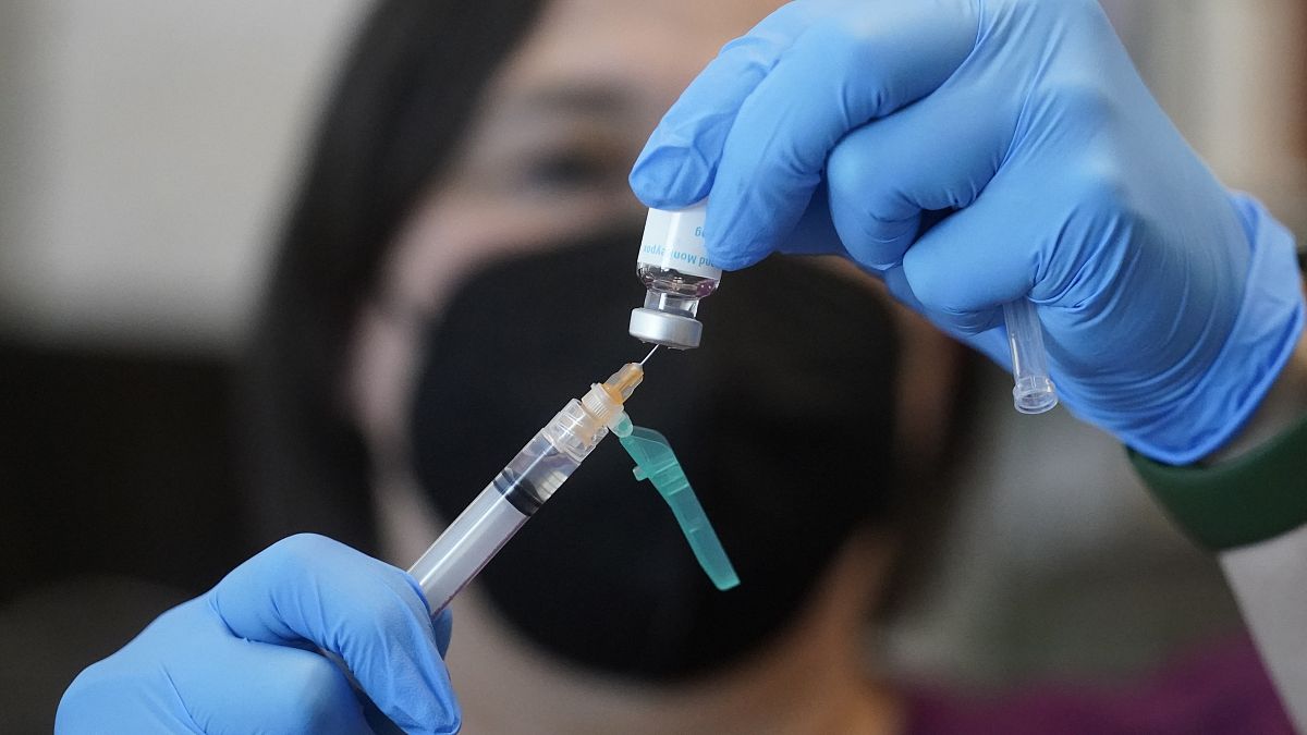 A nurse prepares a dose of a Monkeypox vaccine.