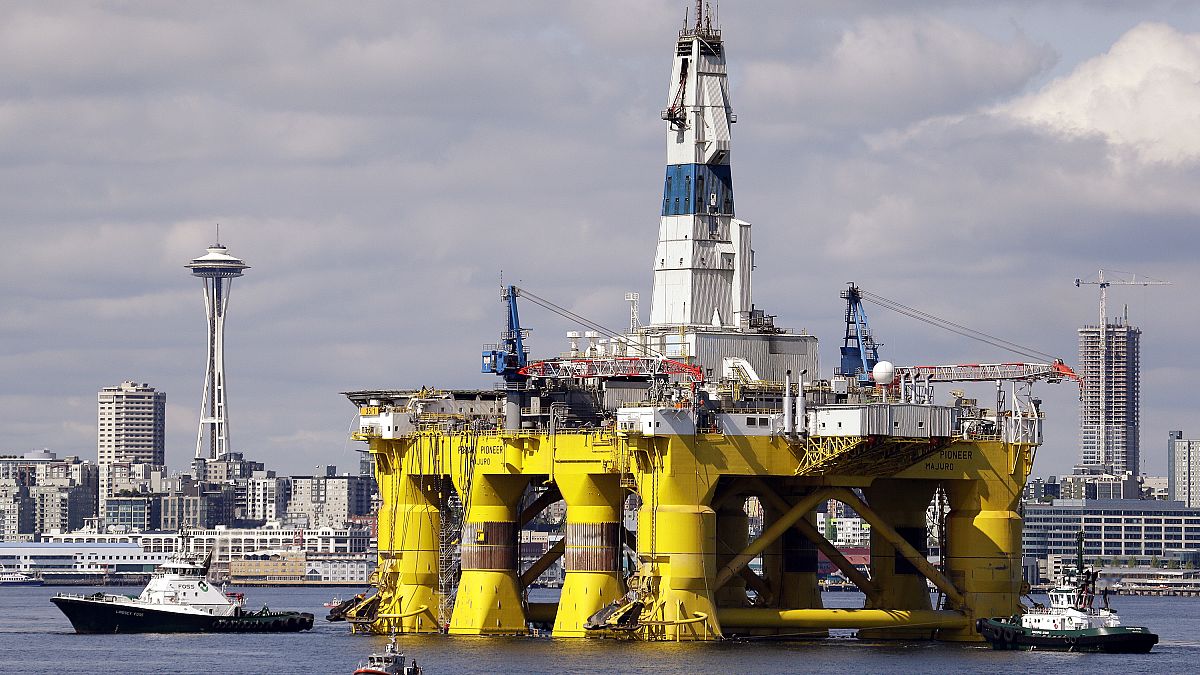 In this May 14, 2015, file photo, the oil drilling rig Polar Pioneer is towed toward a dock in Elliott Bay in Seattle.