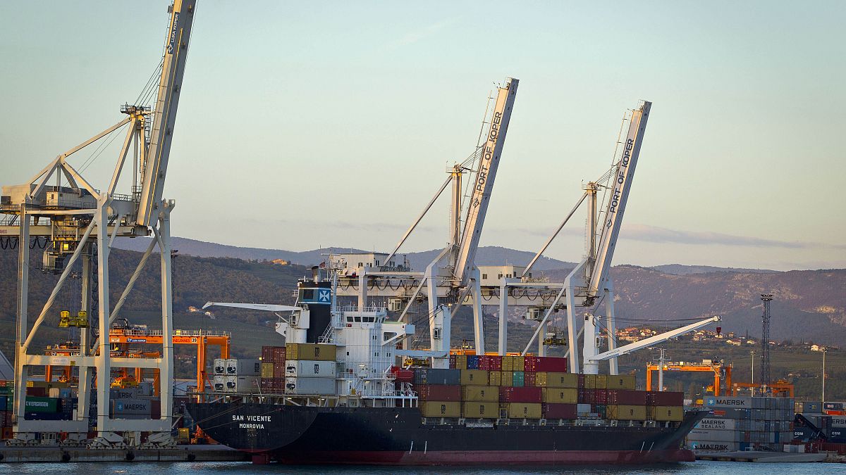 Cranes and a cargo ship are seen in the port of Koper, Slovenia. Sept. 25, 2012.