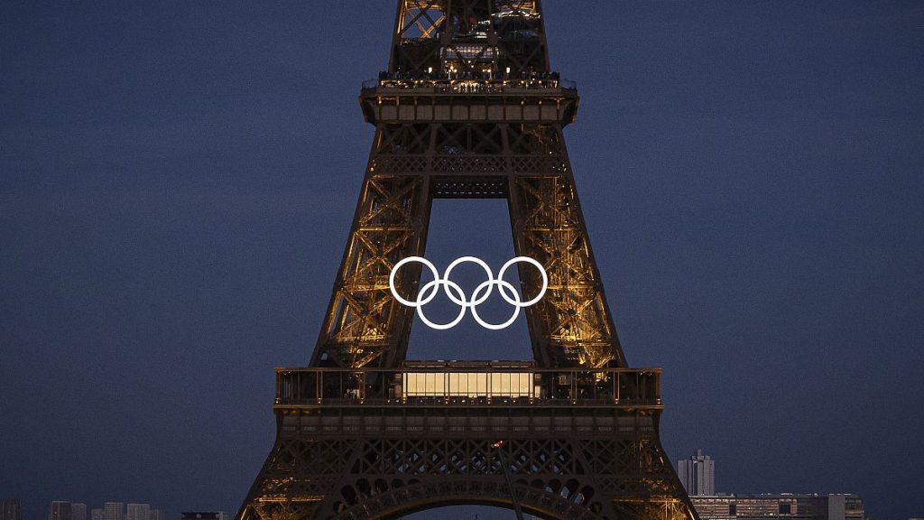 The Olympic rings hanging from the Eiffel Tower