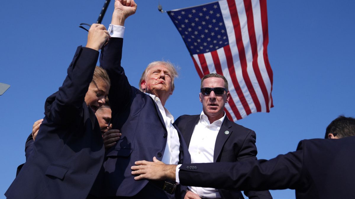 FILE - Republican presidential candidate former President Donald Trump surrounded by US Secret Service agents at a campaign rally, Saturday, July 13, 2024, in Butler, US.