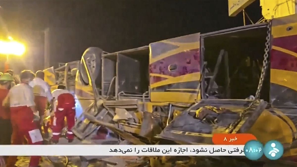 This image taken from a video released by Iranian state television shows the aftermath of a bus crash near Taft, Iran, early Wednesday, Aug. 21, 2024.